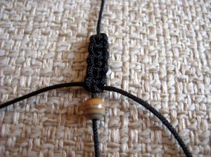 5 knots done and first bead inserted!